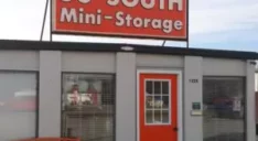 Orange 56 South Mini-Storage sign on top of office building.